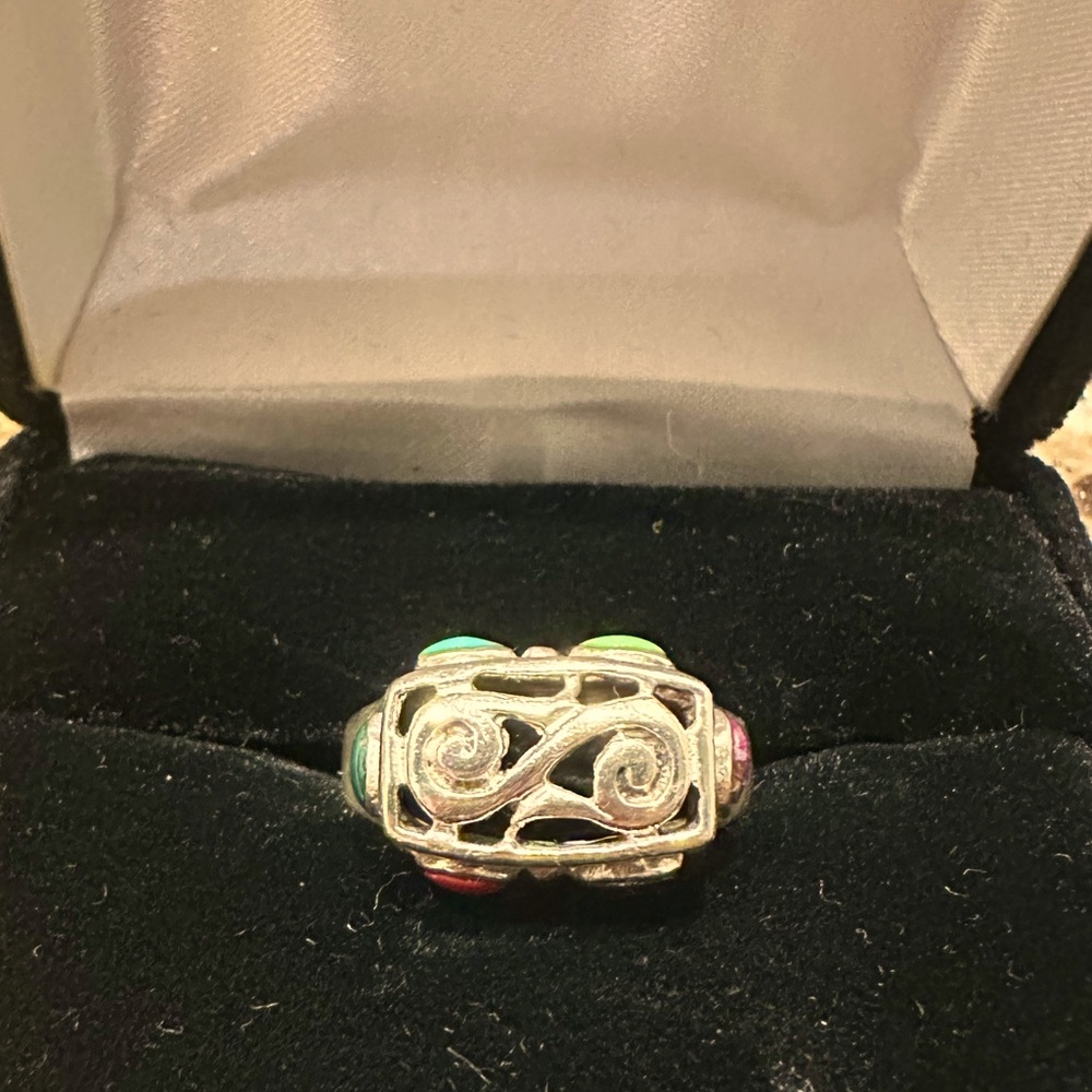 Ring with Scroll design and inlayed stones